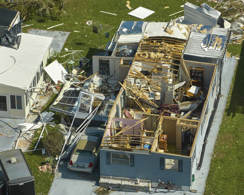 Severely damaged by hurricane Ian houses in Florida mobile home residential area
